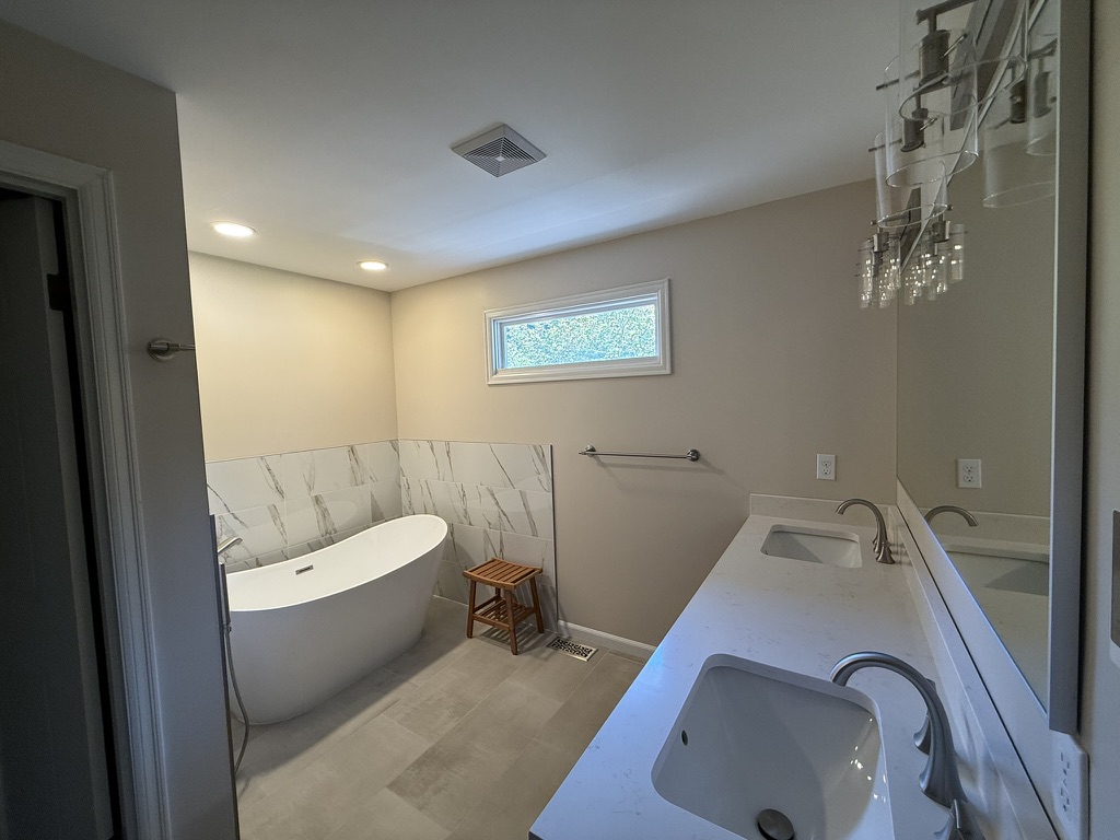 Bathroom Remodel: freestanding tub, double vanity, and light stone-look tile